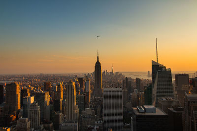 Cityscape against sky at sunset