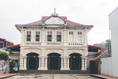 Facade of historic building against sky in city