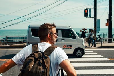 Man on road in city