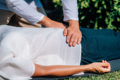 Reiki healing treatment. a therapist is performing a reiki energy healing treatment 