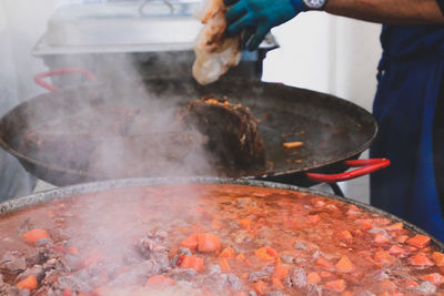 Midsection of chef preparing food