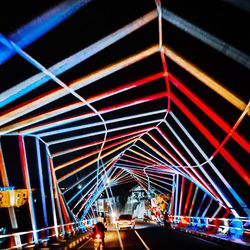 Light trails on road in city at night