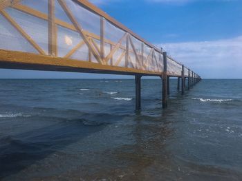 View of bridge over sea against sky