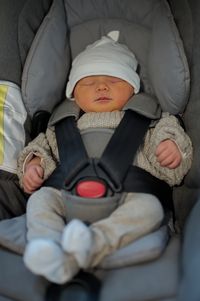 Portrait of newborn baby in baby stroller