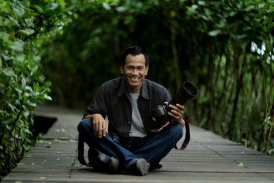 Portrait of man sitting outdoors