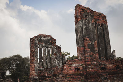 Low angle view of old ruin against sky