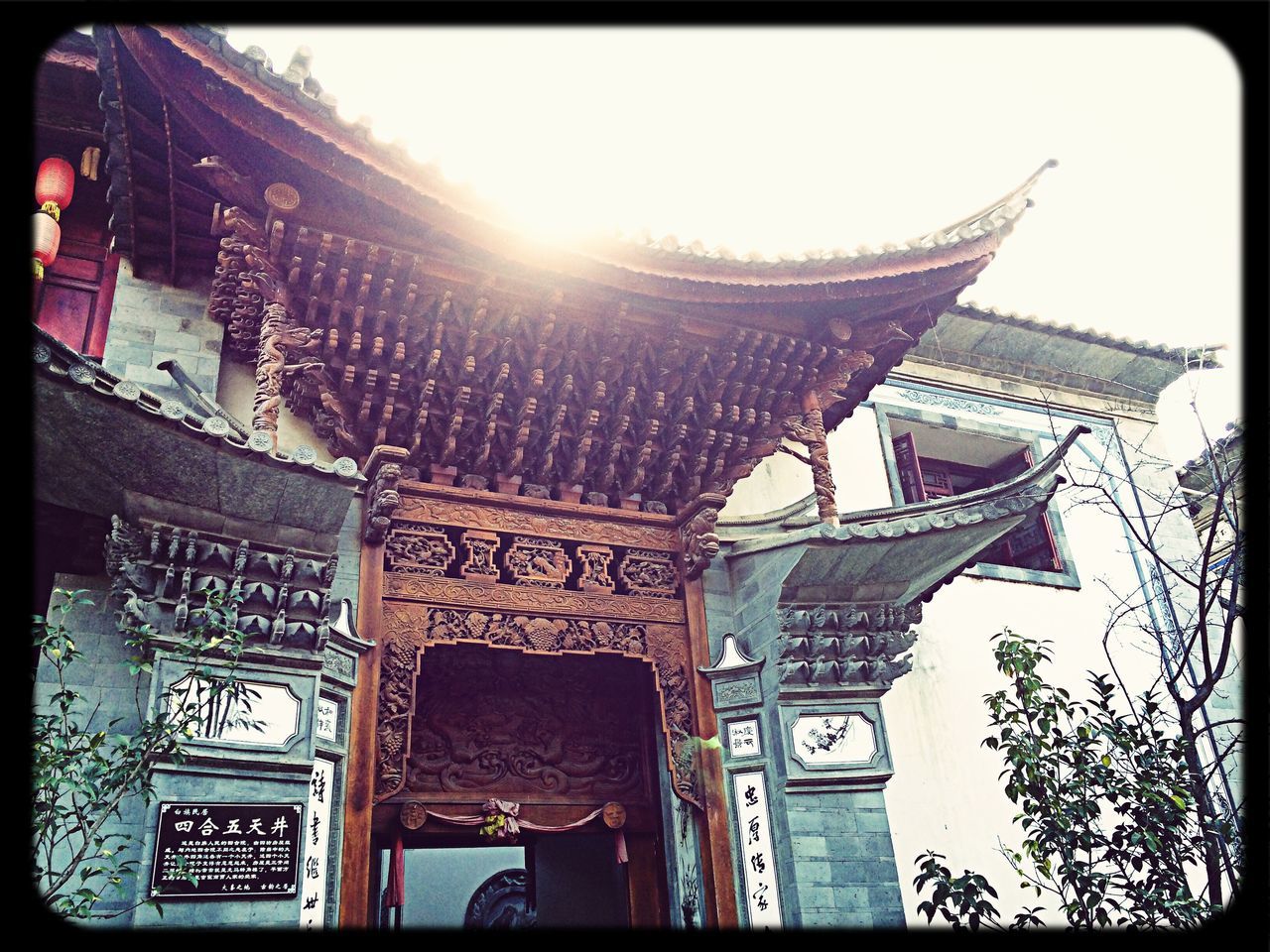 architecture, transfer print, built structure, low angle view, building exterior, auto post production filter, place of worship, religion, sky, spirituality, sunlight, day, architectural feature, no people, building, outdoors, roof, temple - building, clear sky, city