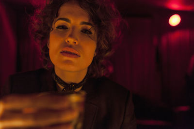 Woman enjoying a drink at a bar