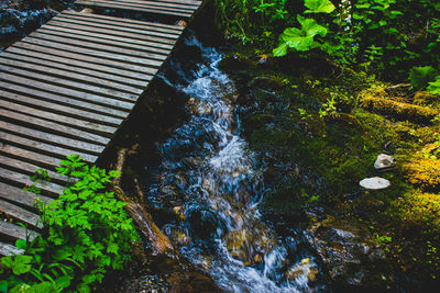 High angle view of waterfall amidst rocks