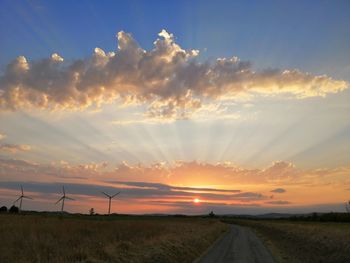 Scenic view of field against sky during sunset