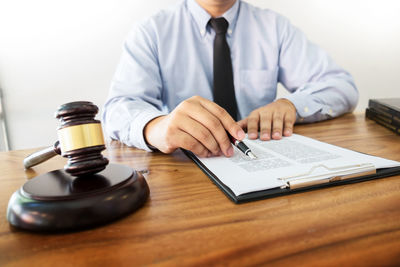 Close-up of man holding table