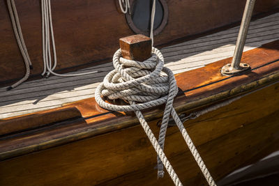 High angle view of ropes tied to sailboat