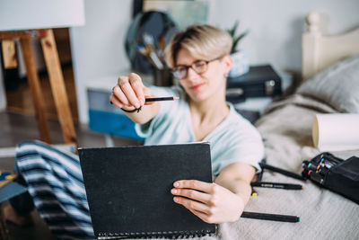 High angle view of woman painting at office