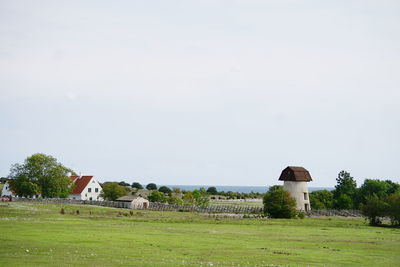 House on field against sky