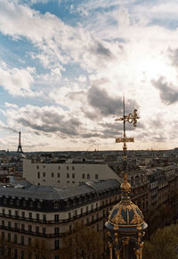 View of buildings against cloudy sky