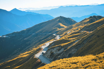 High angle view of snowcapped mountains against sky