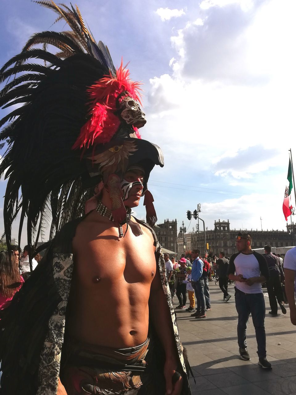 real people, lifestyles, leisure activity, people, incidental people, adult, day, sky, nature, women, cloud - sky, shirtless, standing, men, city, young adult, clothing, outdoors, costume, hairstyle, festival