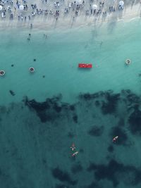 High angle view of people on sea