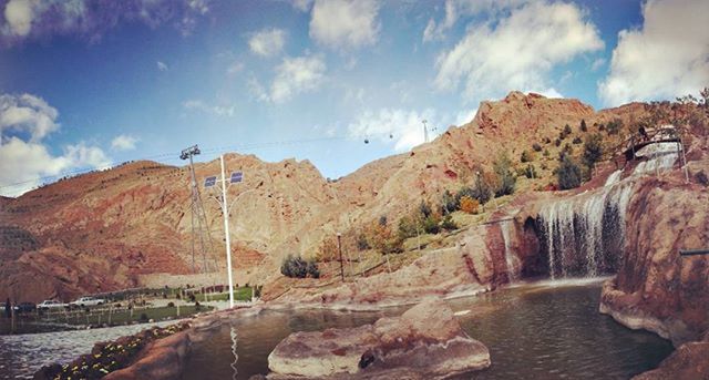 water, rock formation, sky, rock - object, scenics, mountain, tranquil scene, beauty in nature, tranquility, nature, cloud - sky, geology, cloud, river, rock, non-urban scene, cliff, idyllic, rocky mountains, physical geography