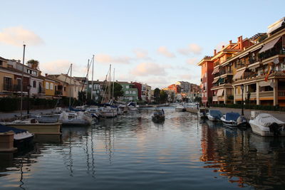 Boats moored at harbor