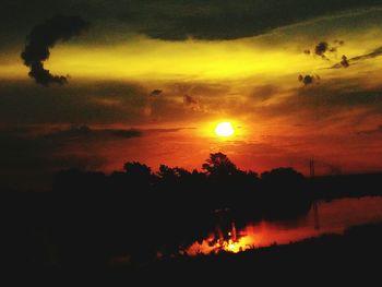 Scenic view of sunset over lake