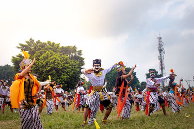 Colossal topeng dance performed by thousands of dancers in the wonosobo square