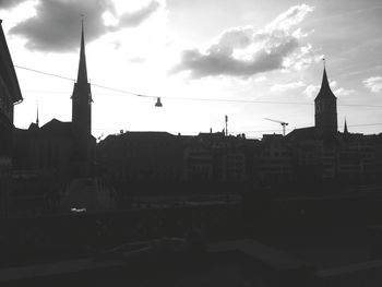 Buildings against cloudy sky