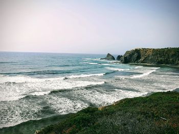 Scenic view of beach against clear sky