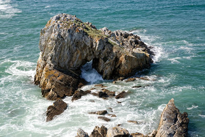 High angle view of rocks in sea