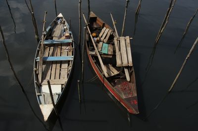 High angle view of sailboats moored in lake