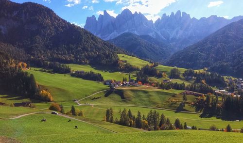 Scenic view of landscape and mountains against sky