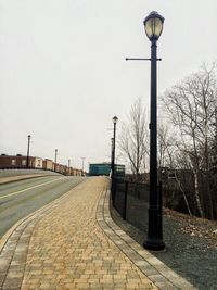 Empty road against clear sky