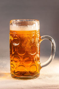 Close-up of beer glass on table