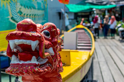 Dragon shape boat on boardwalk