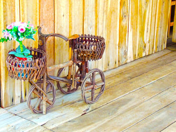 Bicycle in basket against wall