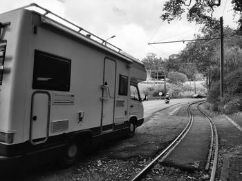 Train on railroad tracks against sky