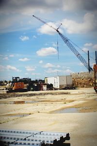 Construction site against cloudy sky