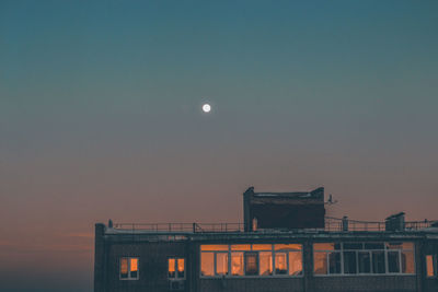 Low angle view of building against sky during sunset