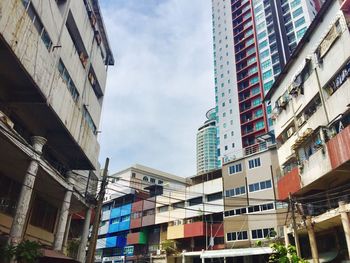 Low angle view of buildings in city against sky