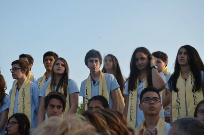 Group of people against clear sky