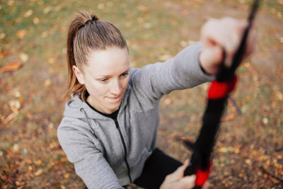 High angle view of woman exercising at park