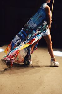 Young woman standing on floor