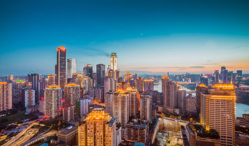 Aerial view of city lit up at night