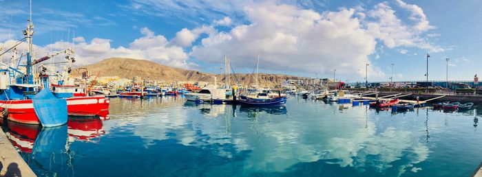 Panoramic view of boats moored at harbor