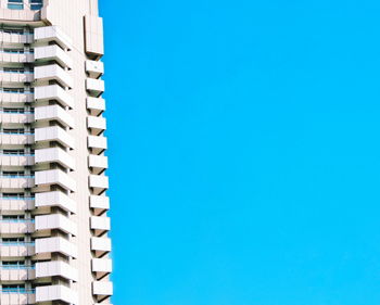 Buildings against clear blue sky