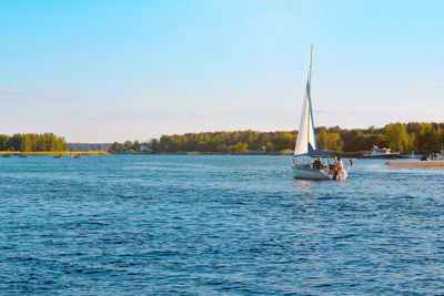 Sailboat on the river,family holidays on a yacht, boat trip, landscape