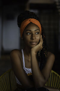 Interior portrait of young latin woman