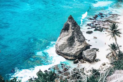 High angle view of rock formation in sea