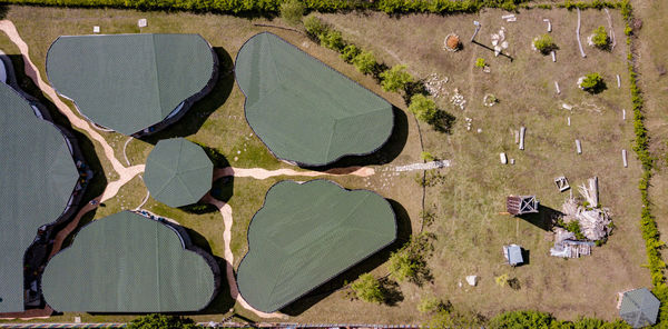 High angle view of old umbrellas on land