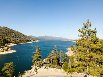 Scenic view of sea against clear blue sky